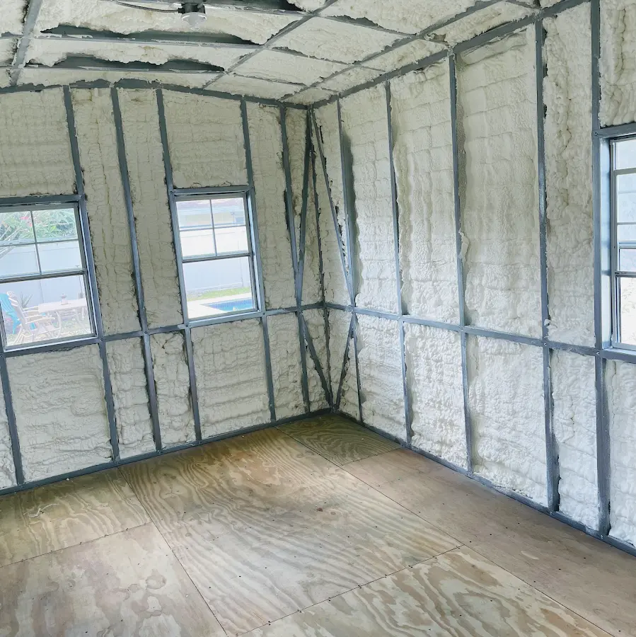 Closed-cell spray foam insulation applied to wall cavities in a residential project in Stonecrest